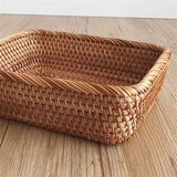 large hand woven rattan basket on hardwood floors