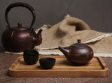 rectangle wooden bamboo serving tray holding tea kettle and small tea cups