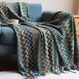 colorful blue bohemian throw blanket on sofa in living room