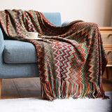 colorful red bohemian throw blanket on sofa in living room
