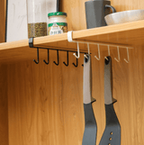 free hanging kitchen rack hanging from shelf holding kitchen tools