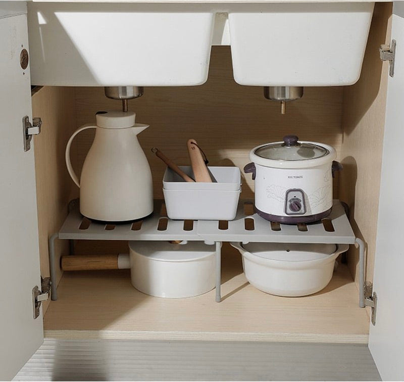 organizing pots and pans with kitchen cabinet organizer