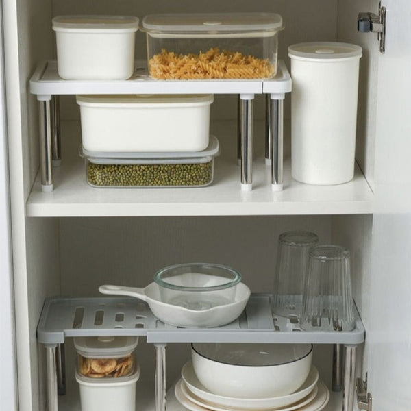 kitchen cabinet organization with shelf racks for sorting cups, plates, and containers