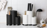 black and white models of multifunctional utensil holder on countertop in kitchen
