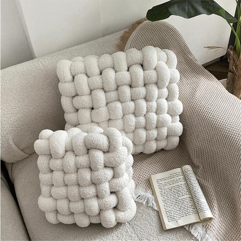 coal and cove white knotted plush cushion on living room sofa as decor