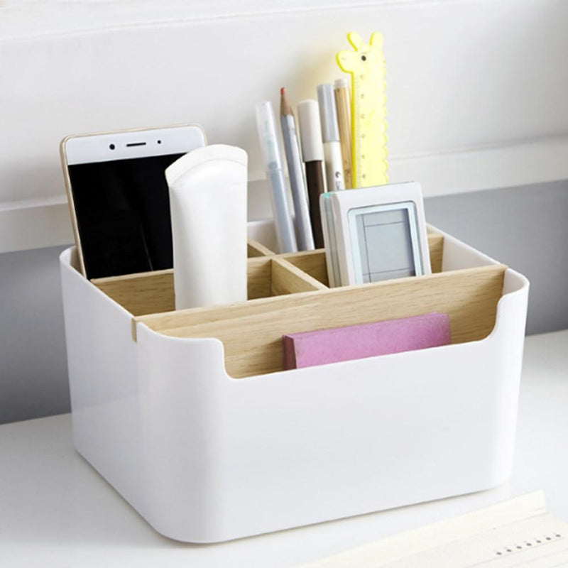 table organizer holding phone and stationery items on work desk