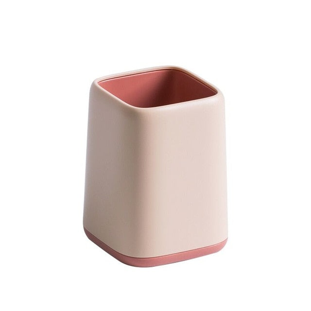 pink and salmon colored minimalist pen holder made of plastic